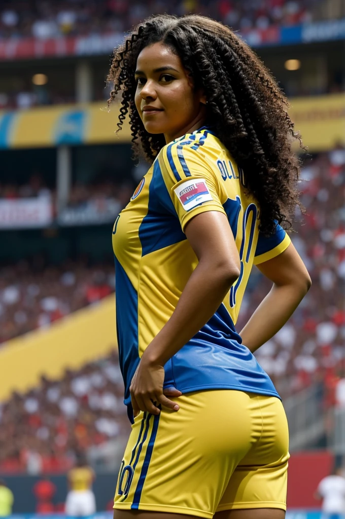 Woman from behind with curly black hair wearing the yellow shirt of the Colombian national team with the number 10