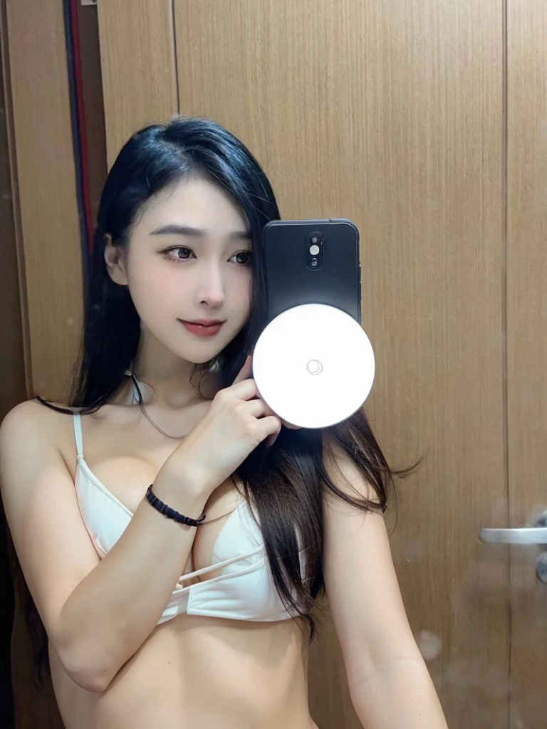 Bikini with cell phone in hand, cleavage is obvious, big breasts