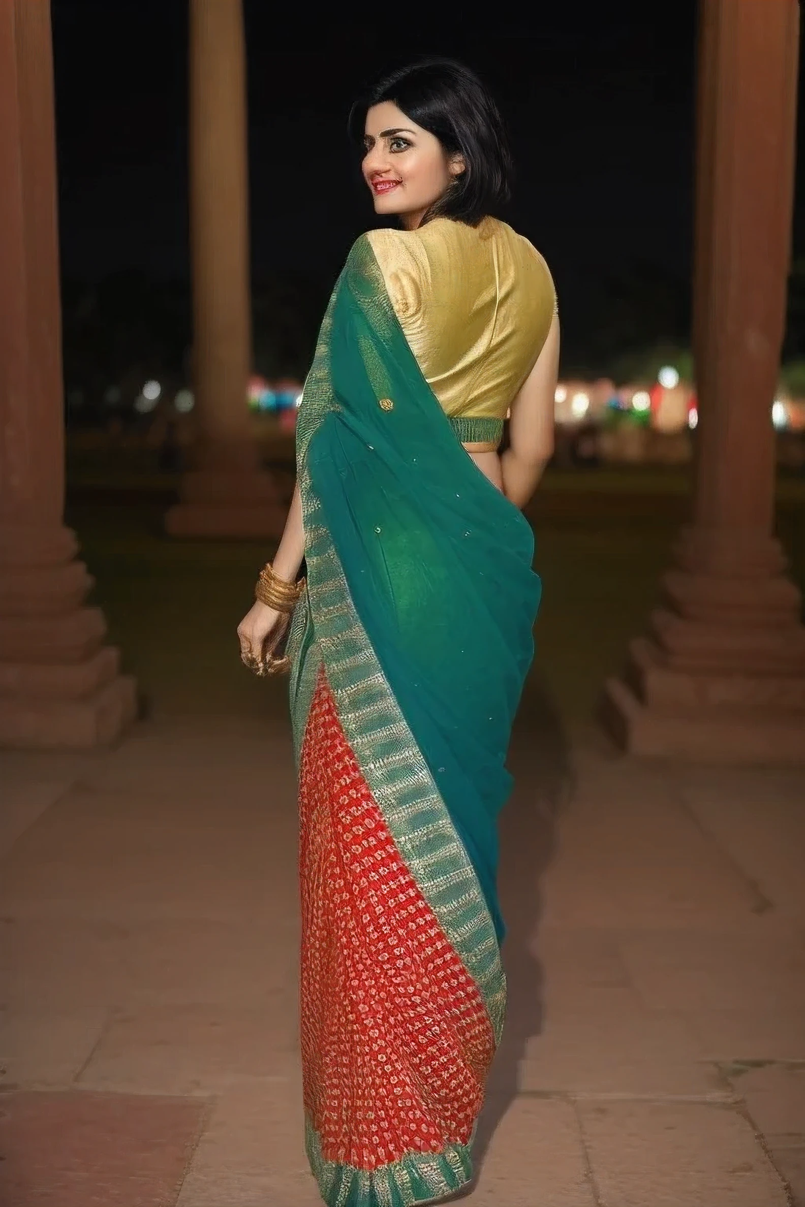 Indian woman blue eye and black hair wering red and green and golden color  Saree and jularis, standing in india  ancient city wide angle shot, side pose, 