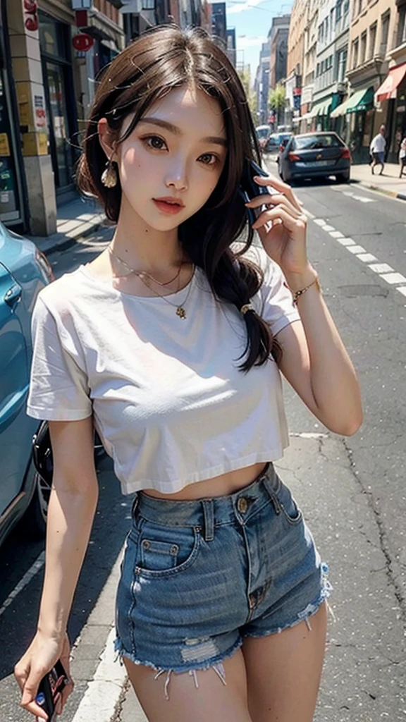 Beautiful woman, fiddling with cell phone in the middle of the street, short clothes