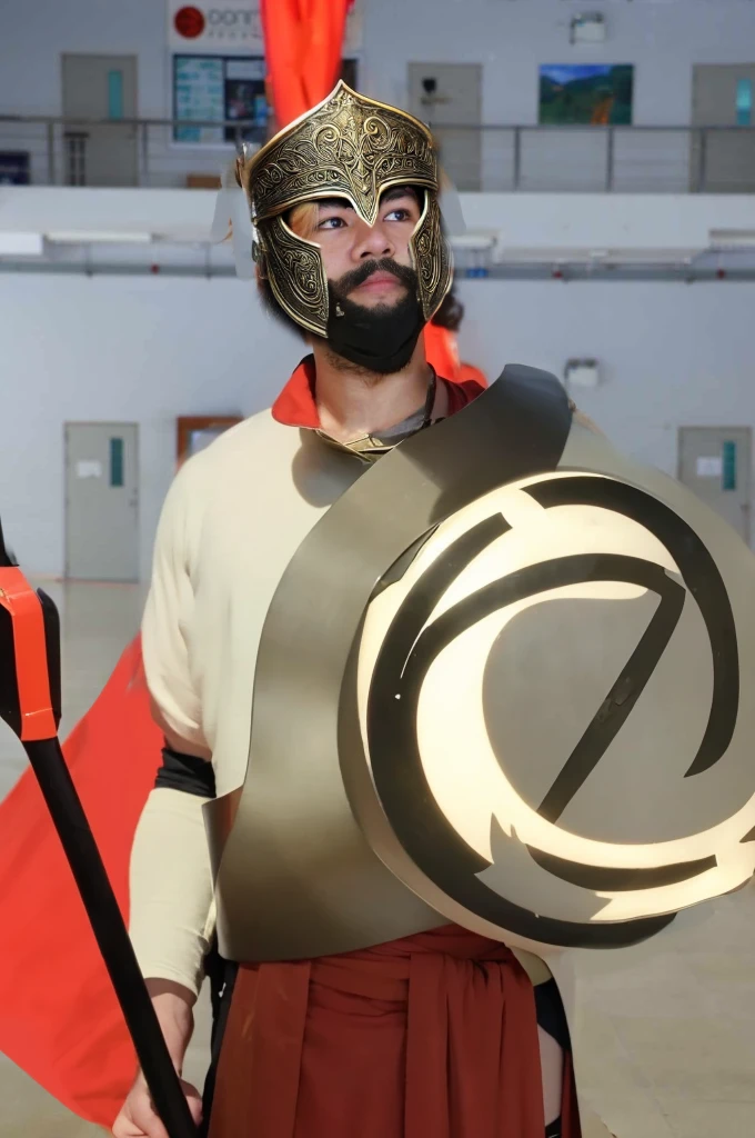 King Leonidas wears a classic Spartan helmet, also known as a Corinthian helmet. It has a bronze finish with a high crest of red and black horsehair, signifying his rank as a king. The helmet covers the entire face except for the eyes, nose, and mouth, providing maximum protection while allowing him to see and breathe easily. The edges are decorated with intricate patterns and engravings.
Armor: His armor is made of bronze and consists of a cuirass (breastplate) with muscle sculpting to emphasize his physical prowess. The cuirass is ornately decorated with engravings of mythical creatures and battle scenes. He wears a red cloak draped over his shoulders, secured with a golden brooch. His greaves (shin guards) and bracers (forearm guards) are also made of bronze and bear similar decorative patterns.
Face: Leonidas has a rugged, determined expression, with a well-defined jawline and a thick beard. His eyes are intense, reflecting his warrior spirit and unwavering determination. His face shows the marks of past battles, with a few scars that add to his fierce appearance.
Spear: He holds a long Dory spear, which is the primary weapon of a Spartan hoplite. The spear is approximately 8 feet long, with a wooden shaft and a leaf-shaped iron spearhead. The shaft is reinforced with metal bands for extra durability, and the butt end is fitted with a bronze counterweight called a sauroter, which can also be used as a secondary weapon.
Shield: Although not specifically requested, it’s worth noting that Leonidas carries a large round shield known as an Aspis or Hoplon. The shield is made of wood, covered with bronze, and emblazoned with the symbol of Sparta, a lambda (Λ).