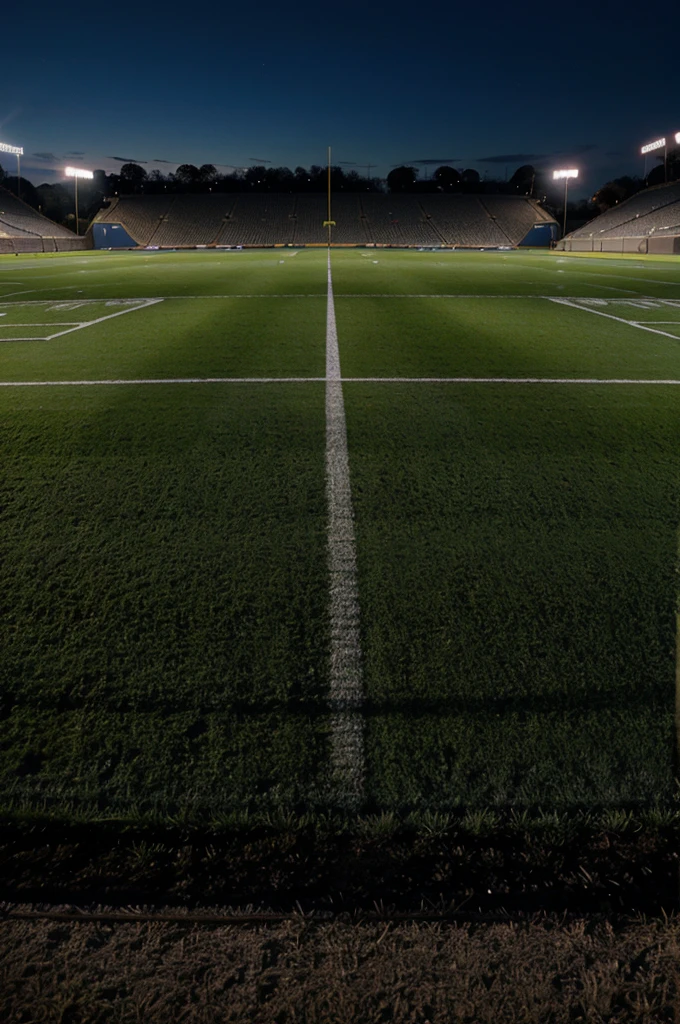 ((landscape)) ((motivating)) football field (( spotlights are seen))