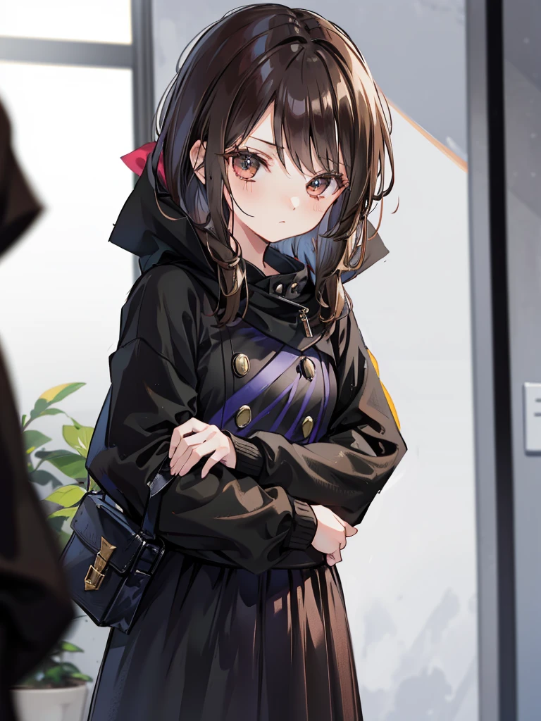 A girl with brown hair standing up in black clothes