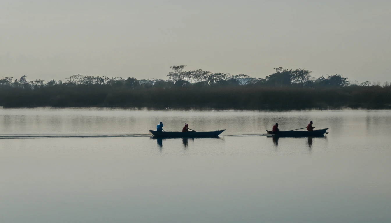 two people in a small boat on a calm lake
