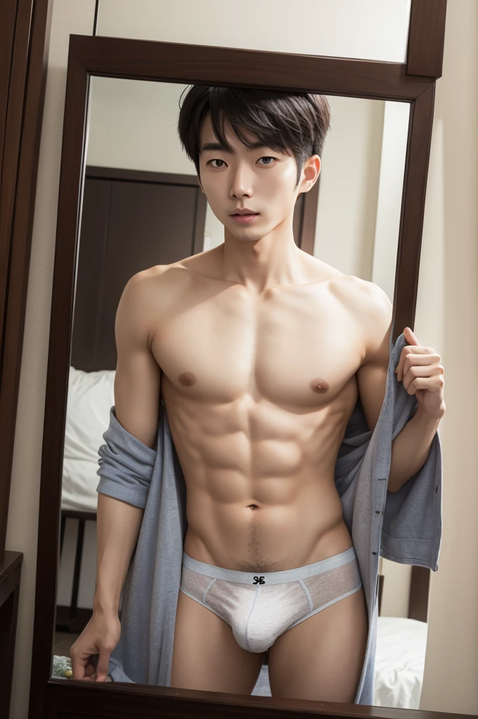 Korean man taking off his underwear in front of the mirror