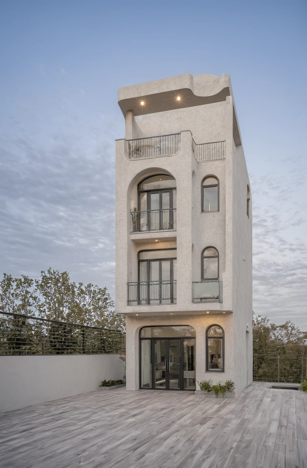 RAW photo,Masterpiece, high quality, best quality, authentic, super detail, modern house, 
exterior, modern house with Modern house, with soft curves, Curved wall,iron railings, glass doors, wall threads, white, gray tones, The balcony on the 1st floor is made of bricks, the wall line, the balcony on the 2nd floor and the terrace are made of iron railings, painted black
daylight, archdaily architecture, (high detailed :1.2), 8k uhd, dslr, soft lighting, high quality, film grain, Fujifilm XT3