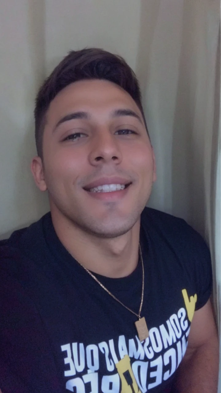 A young man, brown hair, calm smile