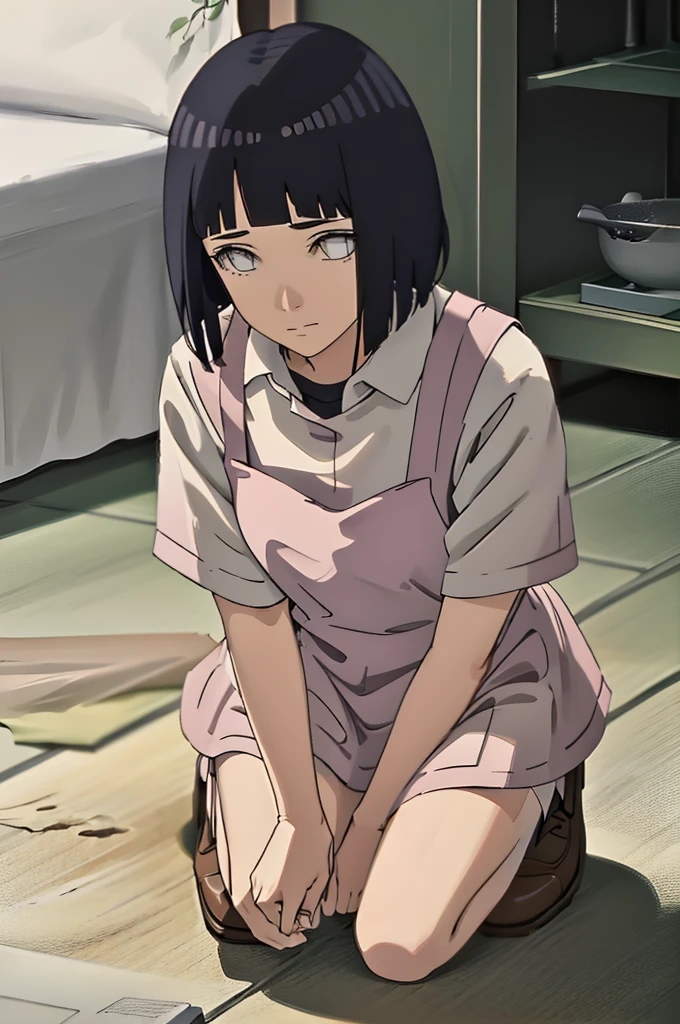 Picking something from the ground,looking at viwer,wearing apron