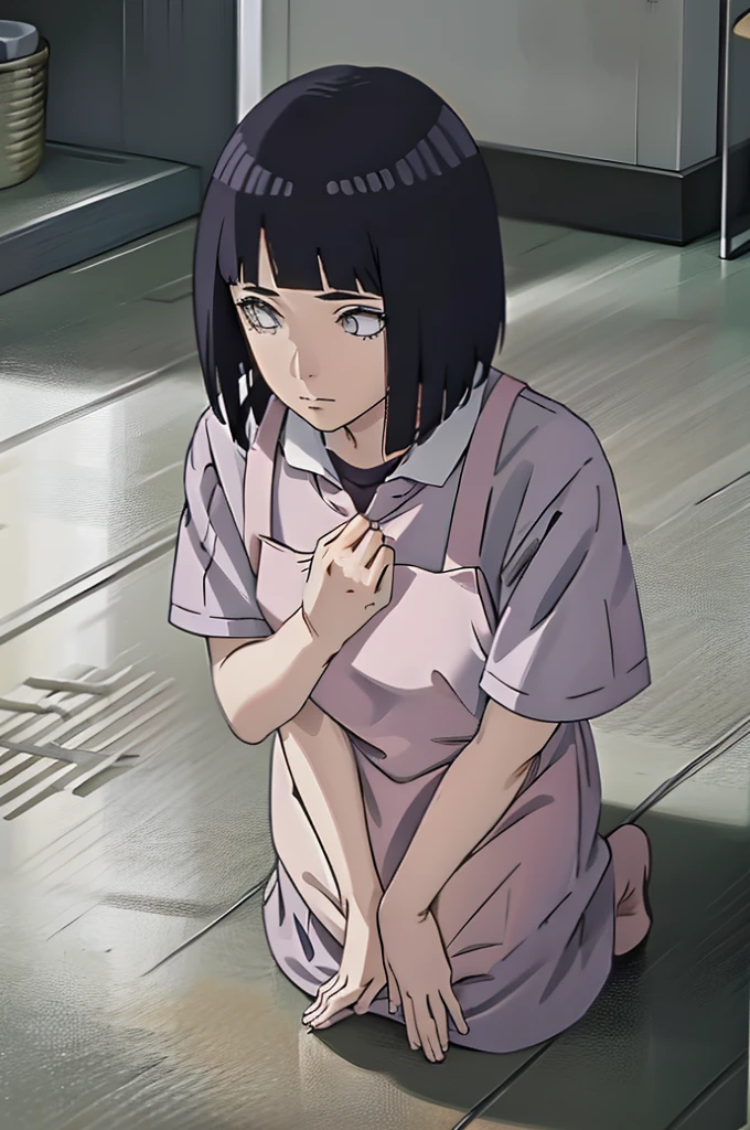 Picking something from the ground,looking at viwer,wearing apron
