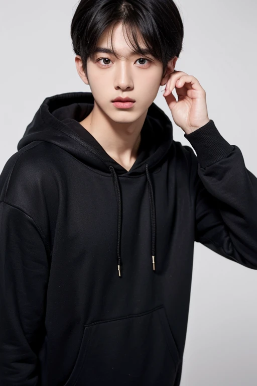 Black hair 20 year old male Korean hoodie white background alone diagonal appearance man with big eyes
