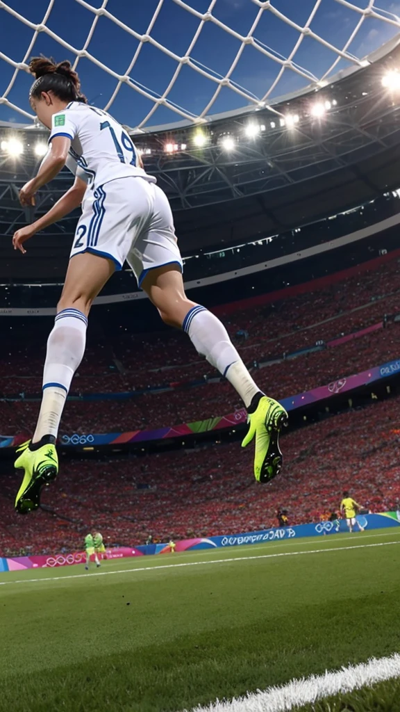 A soccer player is scoring a goal on the Olympic stage。