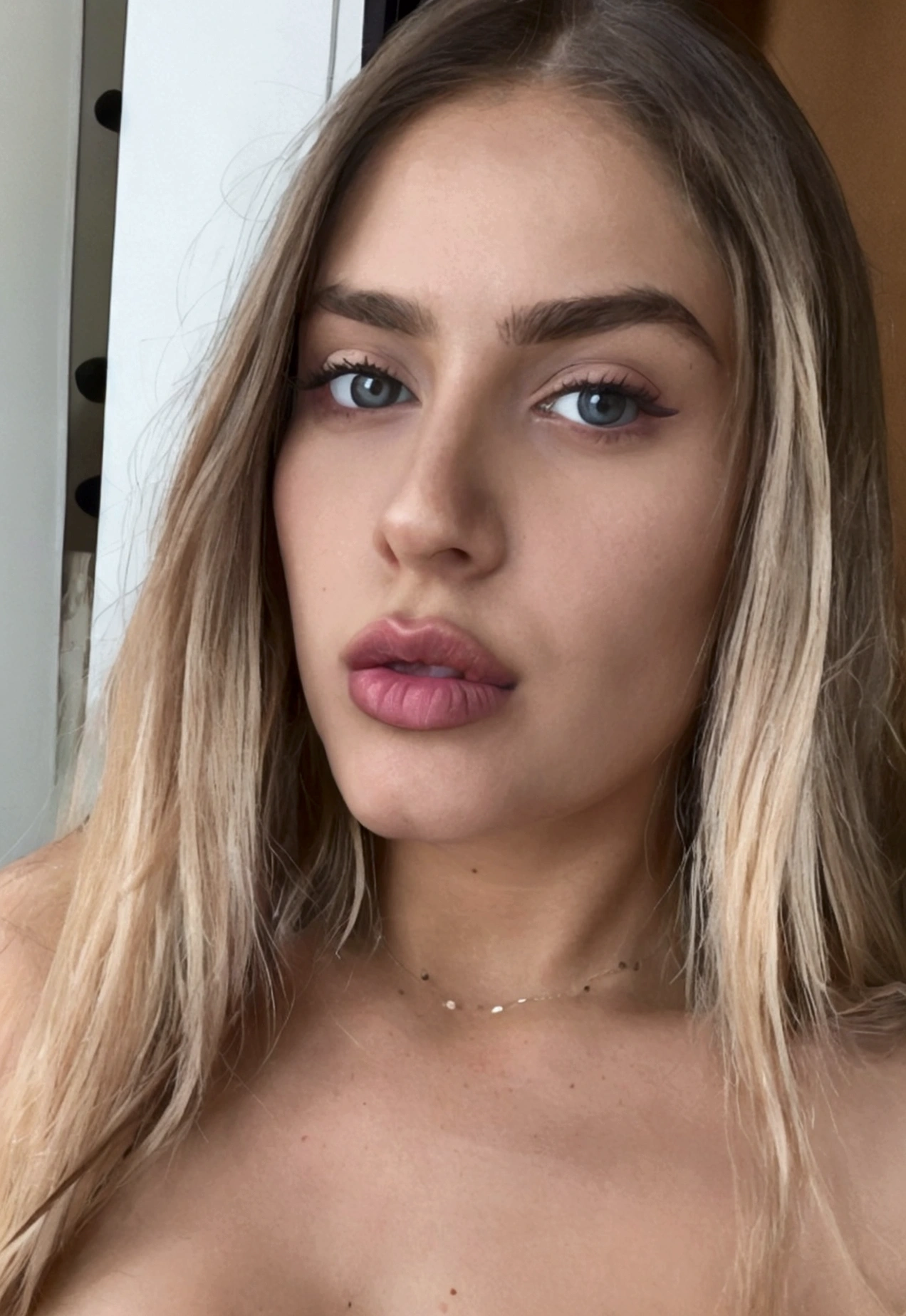 Close-up shot of a gorgeous 25 year old woman from Russia, Long blonde hair, Wearing a spaghetti strap shirt, Athlete, In shape, flexible, silicone breast, Screenshot by Alexis Grimou, Instagram, Letters, Thick lips, Huge lips, sexy lips, big lips, شفاه معززة تBeautifulياً, Huge juicy lips, Violet Myers, Thick red lips, small nose, Big round green eyes, Arched eyebrows, Expressive face, Overrated features, Popular, Beautiful, Attractive