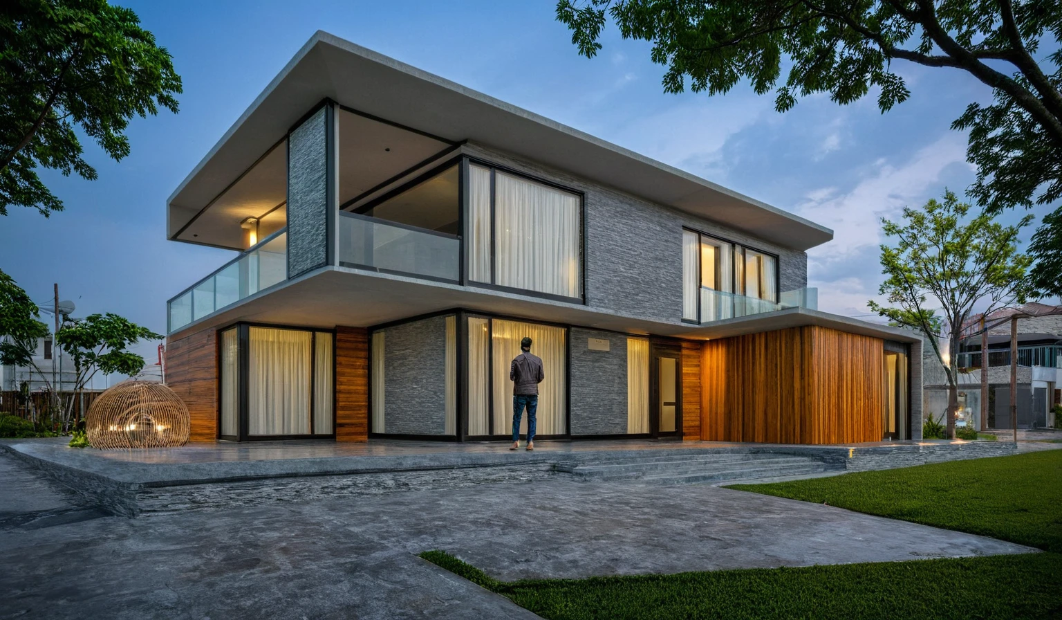 Modern villa on the street, (gloomy light:1.2), cây nhiệt đới, vivid colors, street landscape, Beautiful skies,  Gray concrete and wood walls, (large glass door:1.2), Warm interior lighting, modern materials, best quality, cực kỳ chân thực, masterpiece , 17archiai_Xl_VL-v1