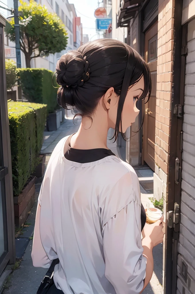 Woman with long hair (short hair with a bun hairstyle), white tea, turning your back to the camera (you can't see the face), with the Colombia shirt (black color), with the number 24 and name say estefania