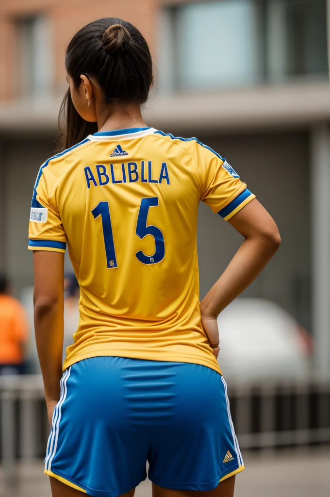 Girl from behind with the Colombian national team shirt with the name Isabella with the number 6