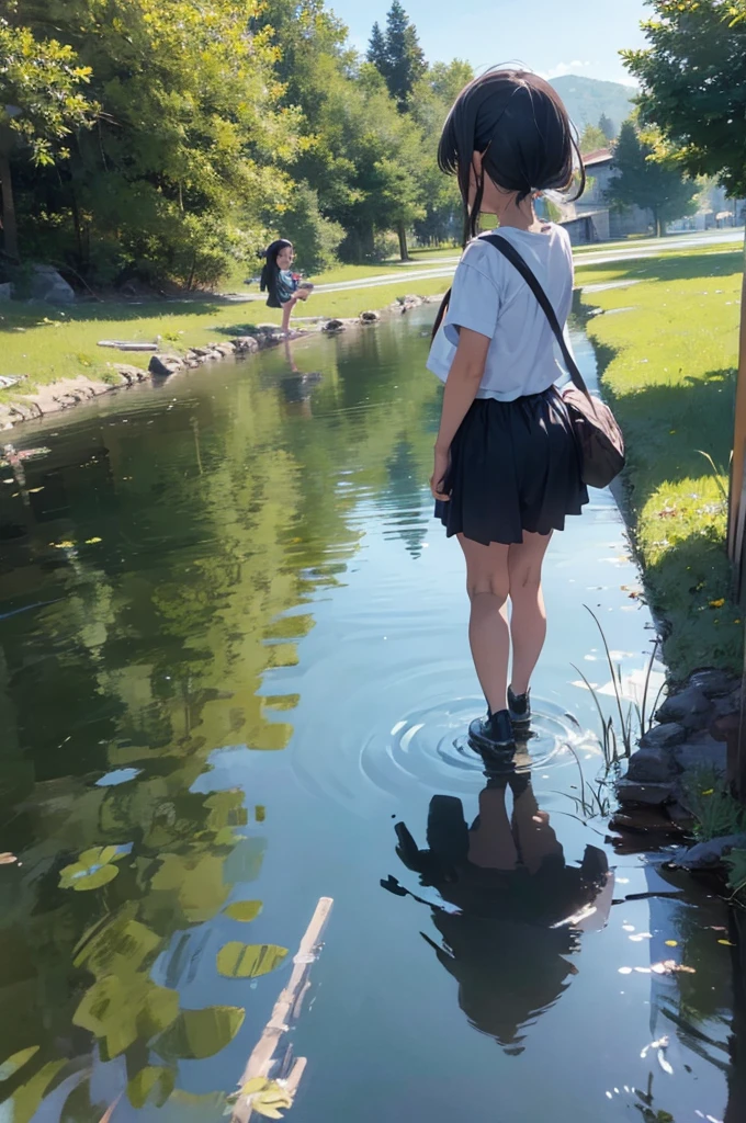 two children playing near a lake

