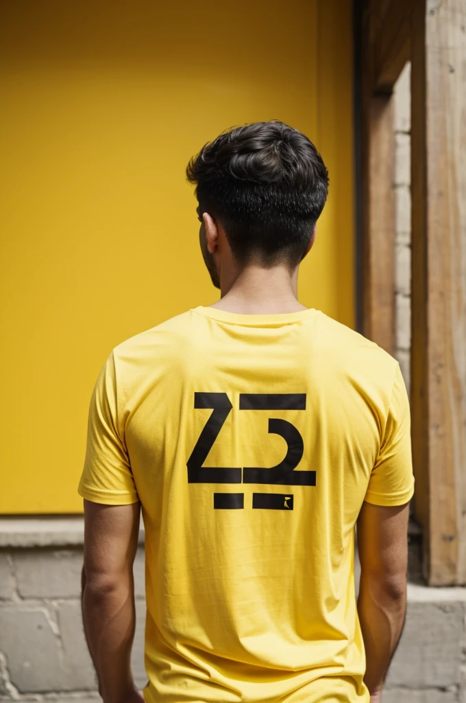 Man from back with yellow t-shirt with name on the back ALDANA