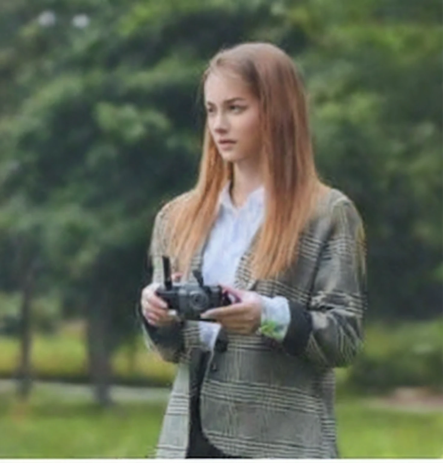 Arafed woman in suit holding a camera and looking at it, Anna Nikonova aka Newmilky, anna nikonova, Aleksandra Waliszewska, Dasha Taran, Anastasia Ovchinnikova, Julia Gorokhova, Style of Julia Razumova, ekaterina, Angelina Stroganova, others podedworna