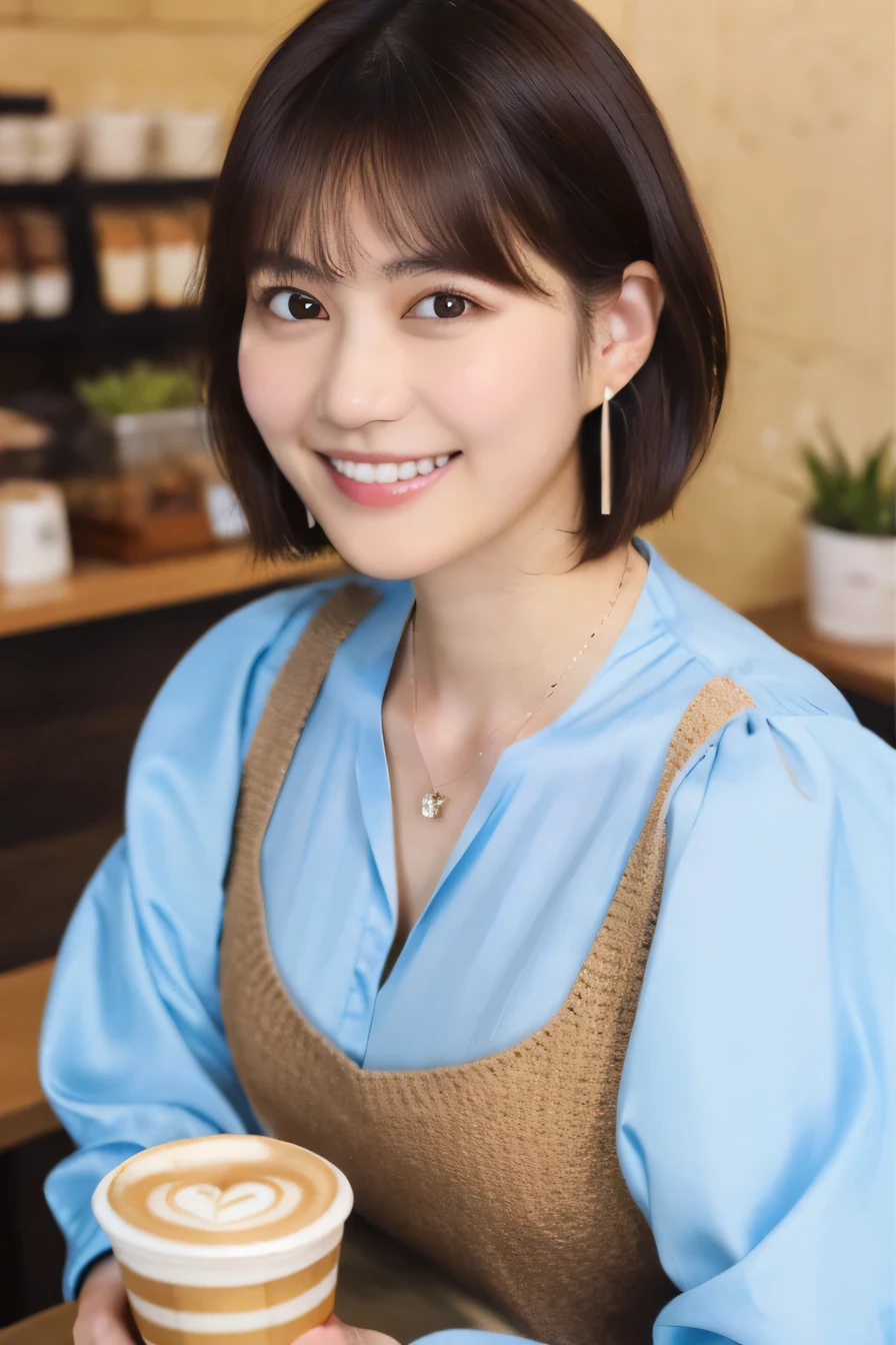 Clear Beauty、Short Haircut、 smile、Beautiful teeth alignment、Brown Hair、ear piercing、Necklace around the neck、Long sleeve blouse、The background is a coffee shop