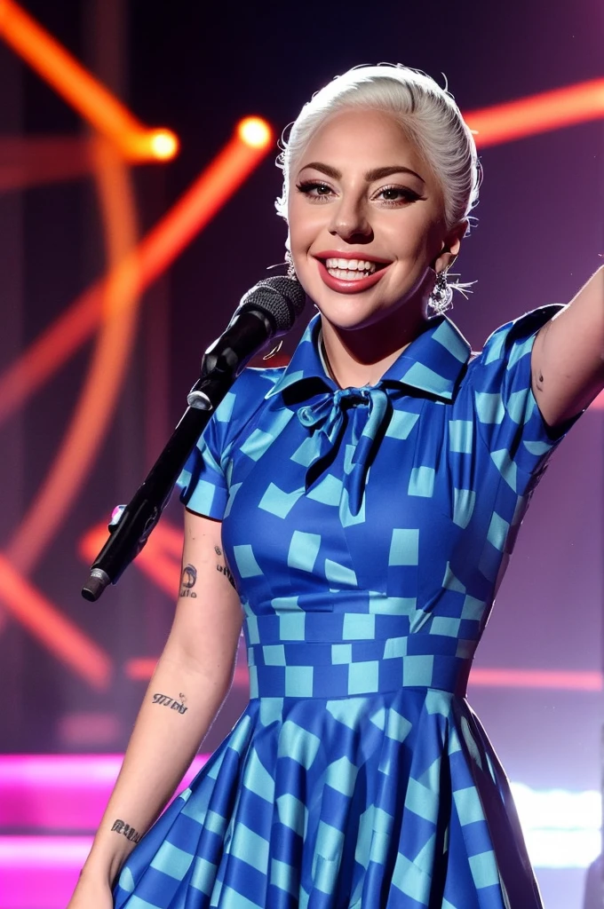 lady gaga smiling, wearing CadetBlue patterned dress, stage, smiling, lights