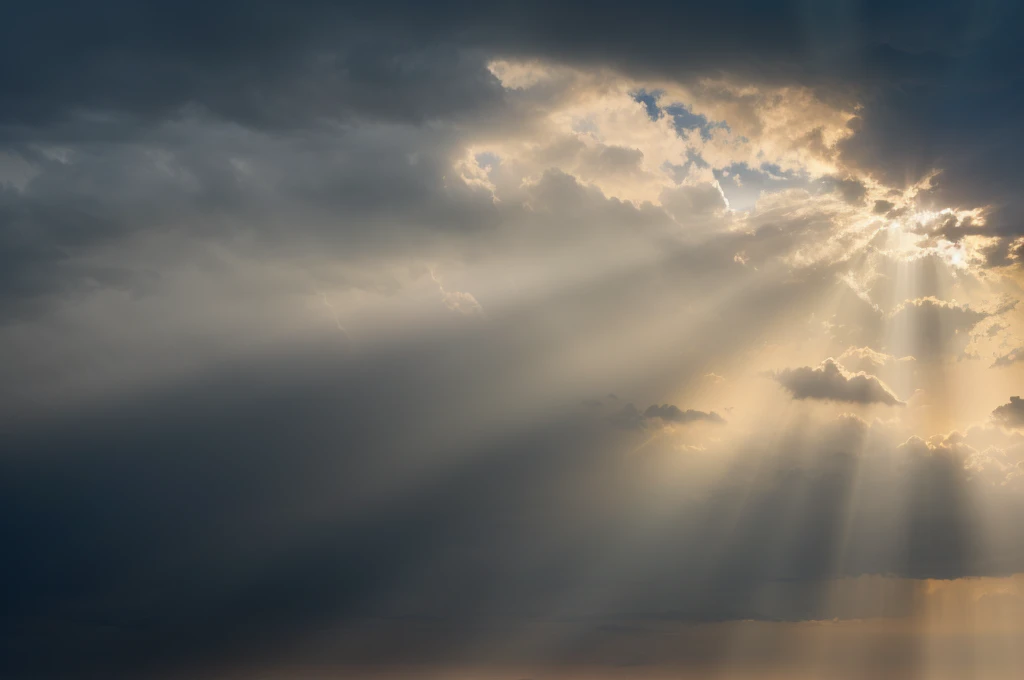 There is a ray of sunlight in the sky shining through the clouds, Light of God shining from above, sunrays between clouds, Beams of light in the sky, Theatrical lighting with divine brilliance, sunlight penetrates the clouds, Light of God, Sunlight passing through the sky, Sun rays in the sky, rays of life, Some light, Light from above