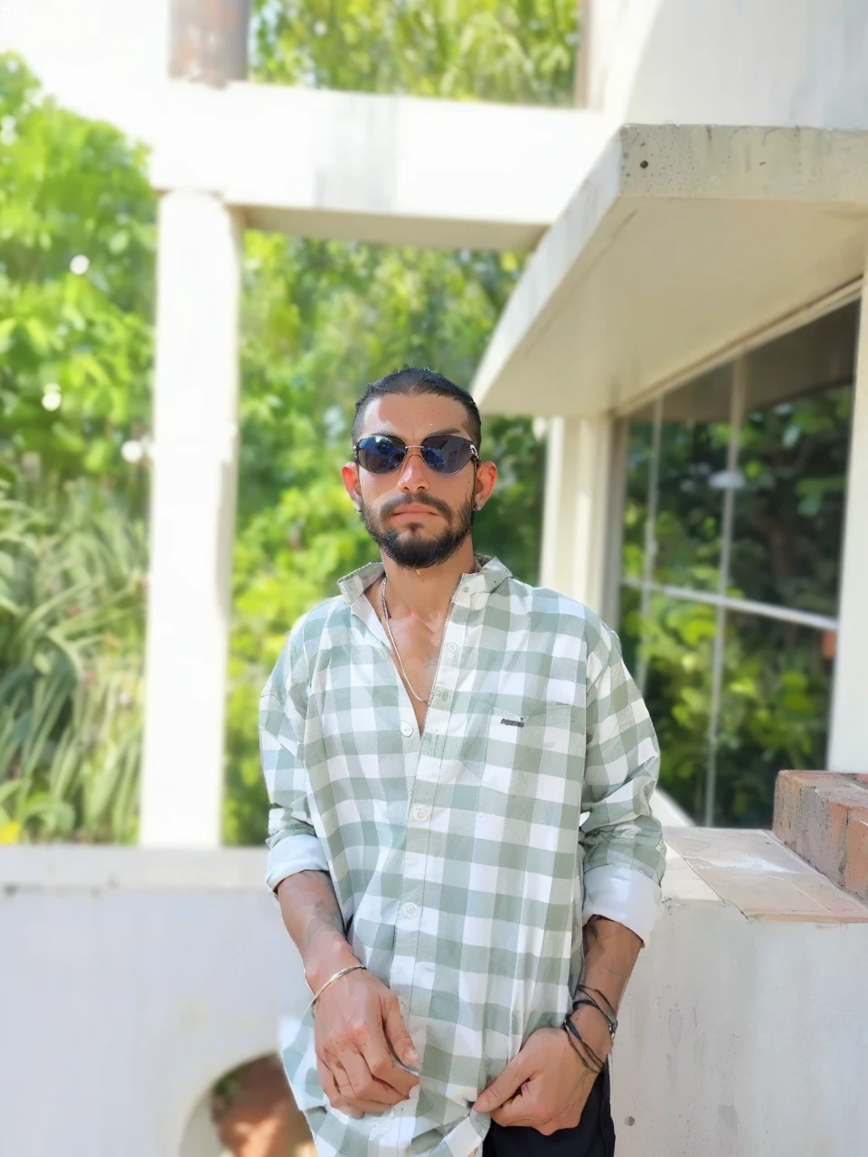 photography of a heavy metal star, a solo man, 25 years old, singer, bad boy, black eyes, expressive look, long dark blue black hair, straight hair, blueshine hair, unshaven, black leather jacket, leather pants, chest tattoo, super detailed face, perfect shapes,
(male:1.5), muscle, 1boy, pectoral, muscular, macho man, (((dark_blue_eyes:1.3))),intricate eyes,beautiful detailed eyes,symmetrical eyes,
(heavy metal clothes),(((dark coat))),((bulge in pants)),(((intricate outfit,intricate clothes))),
(dynamic pose:1.0),embarrassed,(centered,scale to fit dimensions,Rule of thirds),
((beautiful bath house made of greek marble and pillars, beautiful clear water in pool)),scenery:1.25,((intricate scenery)),((greek temple background)),
(Glossy greek ornaments),highres,sharp focus,(ultra detailed,extremely detailed),(photorealistic artwork:1.37),(extremely detailed CG unity 8k wallpaper),(((vibrant colors,vibrant theme))),(intricate),(masterpiece),(best quality),artistic photography,(photography taken by sldr),(intricate background),perfect rendered face,perfect face details,realistic face,photo realistic,((intricate detail)),(((realism))),