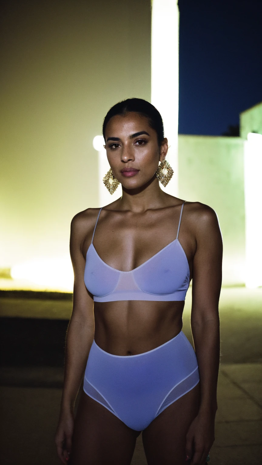 RAW photo,flash,hazy atmosphere,35mm focal lenght,fashion shoot,candid photograph,artistic,photograph of a beautiful,influencer,30yo Moroccan woman,detailed skin,fully naked,looking at viewer, candid pose,standing outside,midnight,dark,flash photo,blue light, film grain, kodak color, instagram LUT