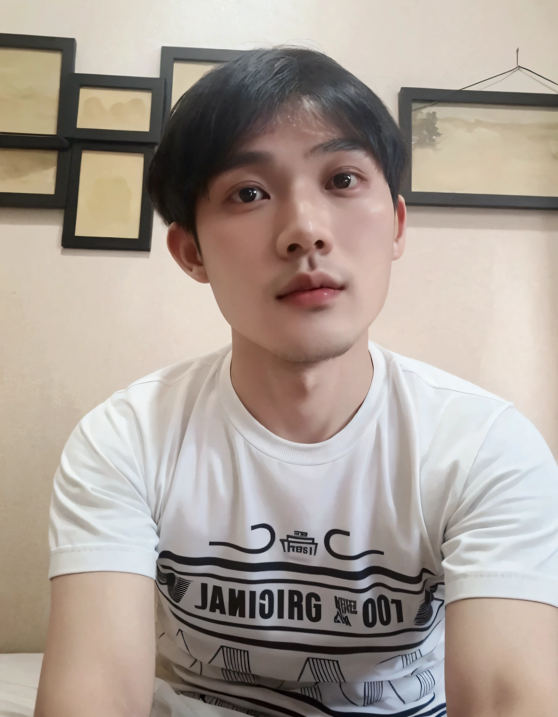 there is a young man sitting on a bed with a white shirt, 2 , 2 8 years oldinh, hoang long ly, 2 9 years old, dzung phuo pham, thawan duchanee, 2 3 years old, bao phan, phong yintng geping