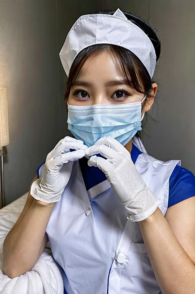 Female nurse wearing gloves covers patient’s mouth with cloth