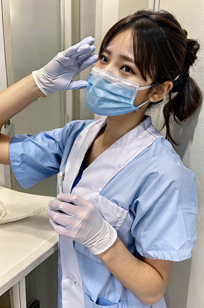 Female nurse wearing gloves covers patient’s mouth with cloth