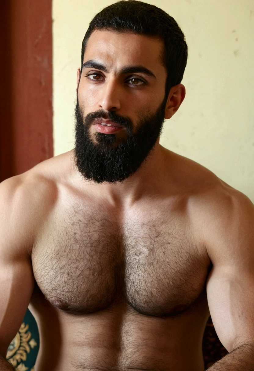 Arab man with pale skin, bushy beard, greenish eyes, straight nose, thin lips, square and sharp marked jaw, somewhat plump complexion, with muscular arms. He sits masturbating his erect member in a room showing his hairy chest