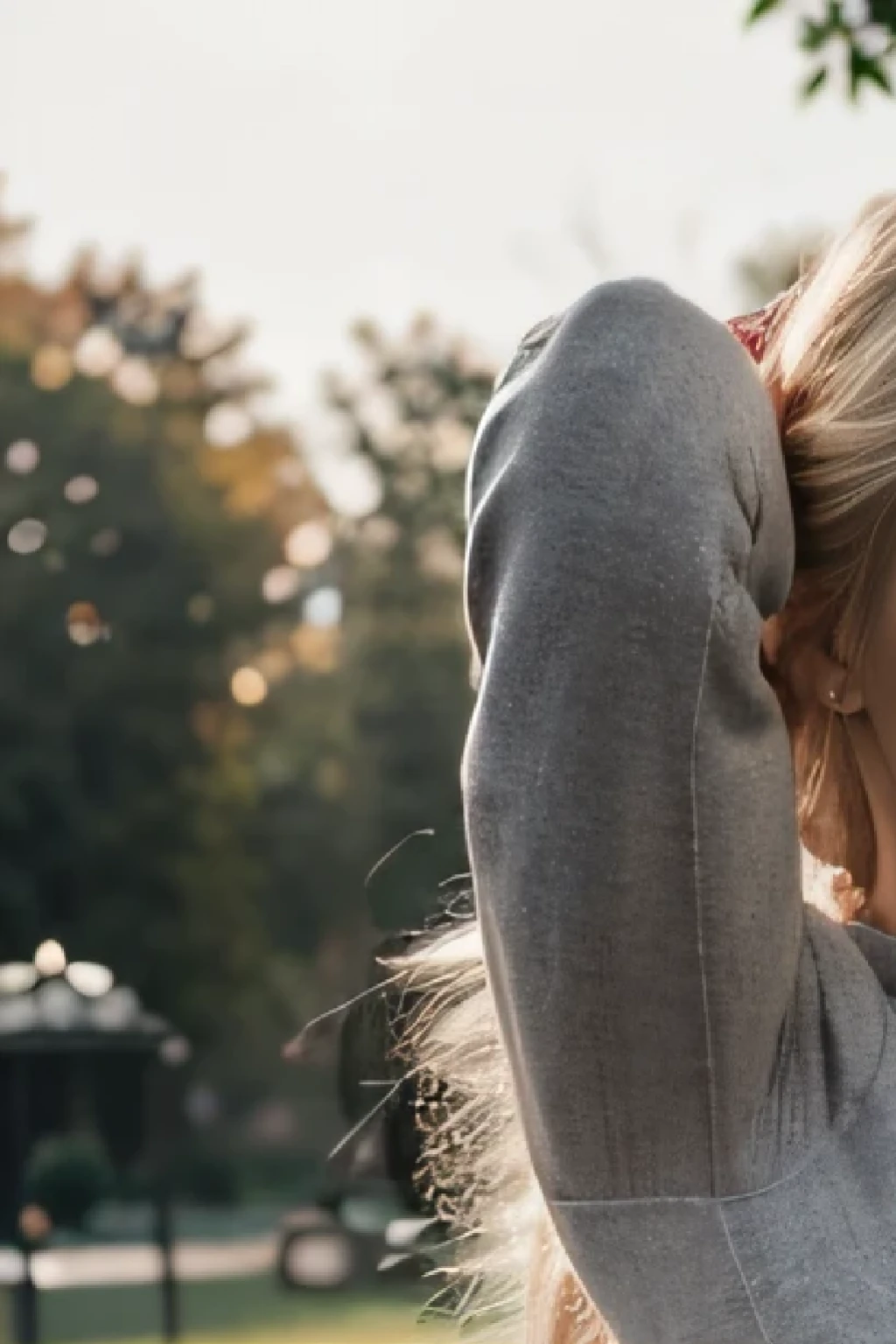 blonde woman in a gray top and gray trousers poses for a photographer, in the city park, in the park, beautiful face with arms and legs, in the park, satisfied pose, Anna Nikonova, aka Newmilky, her navel is exposed, Attractive pose, Alexandra Valishevskaya, tight outfit, Dasha Taran, in the park