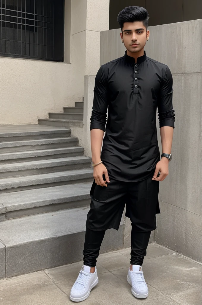 A 23 year old boy wear black kurta and black pant with white high top shoes and has clean shave