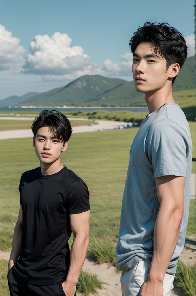 A young Asian man stands, handsome, muscular, looking at the camera. In a simple black t-shirt, Fieldside, grass, beach, sunlight