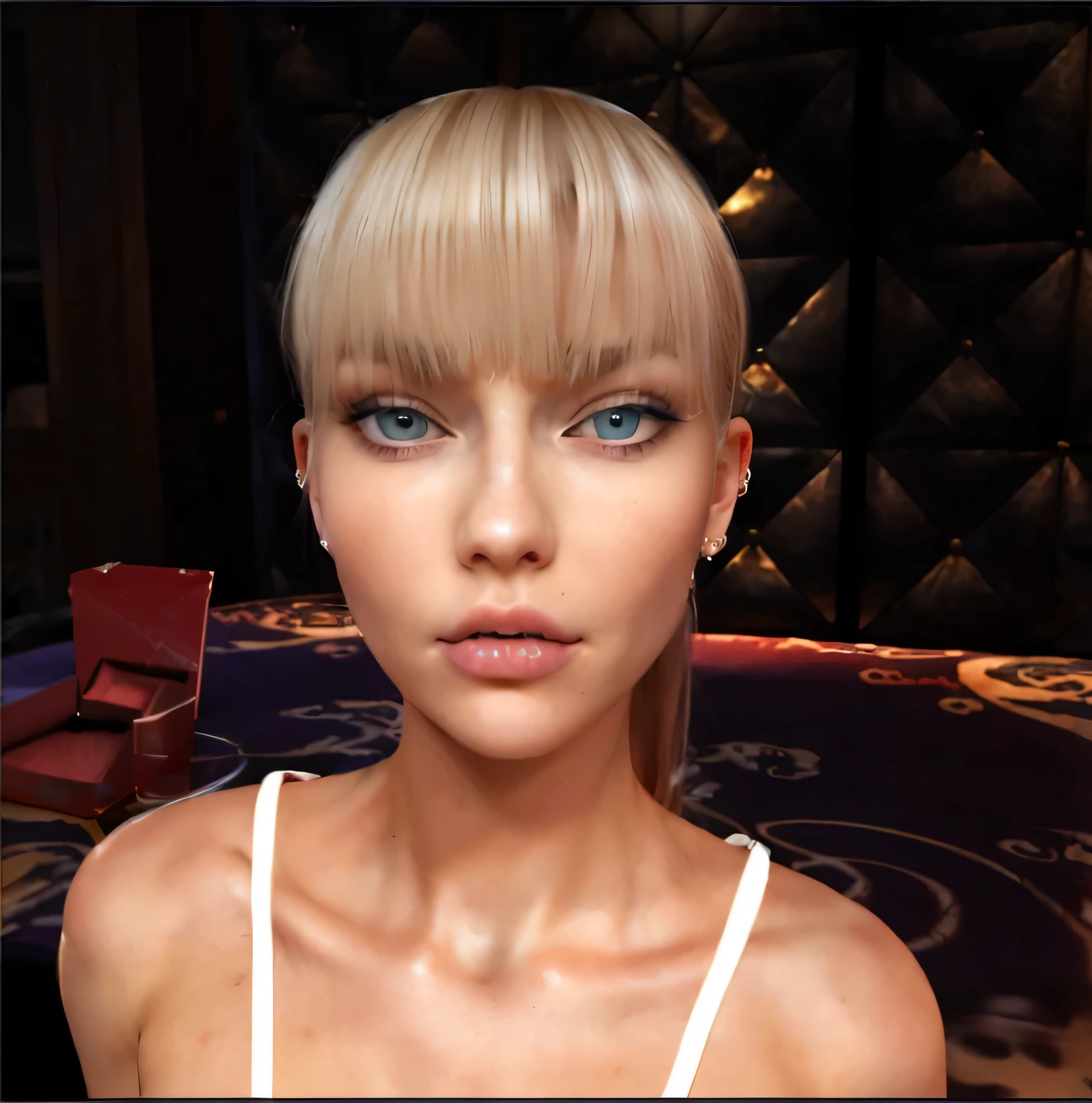 a beautiful blonde woman with long hair combed back with straight bangs over her forehead. She has dimples on her face. Blue eyes, she has a beauty mark over her mouth on the left side, wears a ring piercing in her left nostril and a diamond piercing in the right nostril. She has a closed mouth, small and fleshy