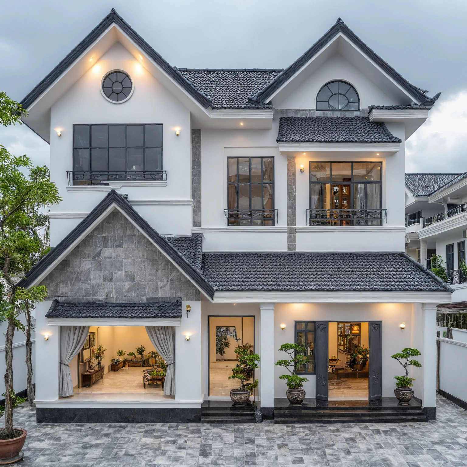 (bright image), A double story modern style house in the middle of Vietnam, (dark grnite tiled wall),(classic detail), simple and elegant architecture with white walls on top half and grey tiles roof, large windows with, entrance door is white with arched shape, bonsai trees, wide tile stone courtyard, professional photography, daylight, natural light, high resolution photography, (best quality, ultra realistic, masterpiece:1.15)