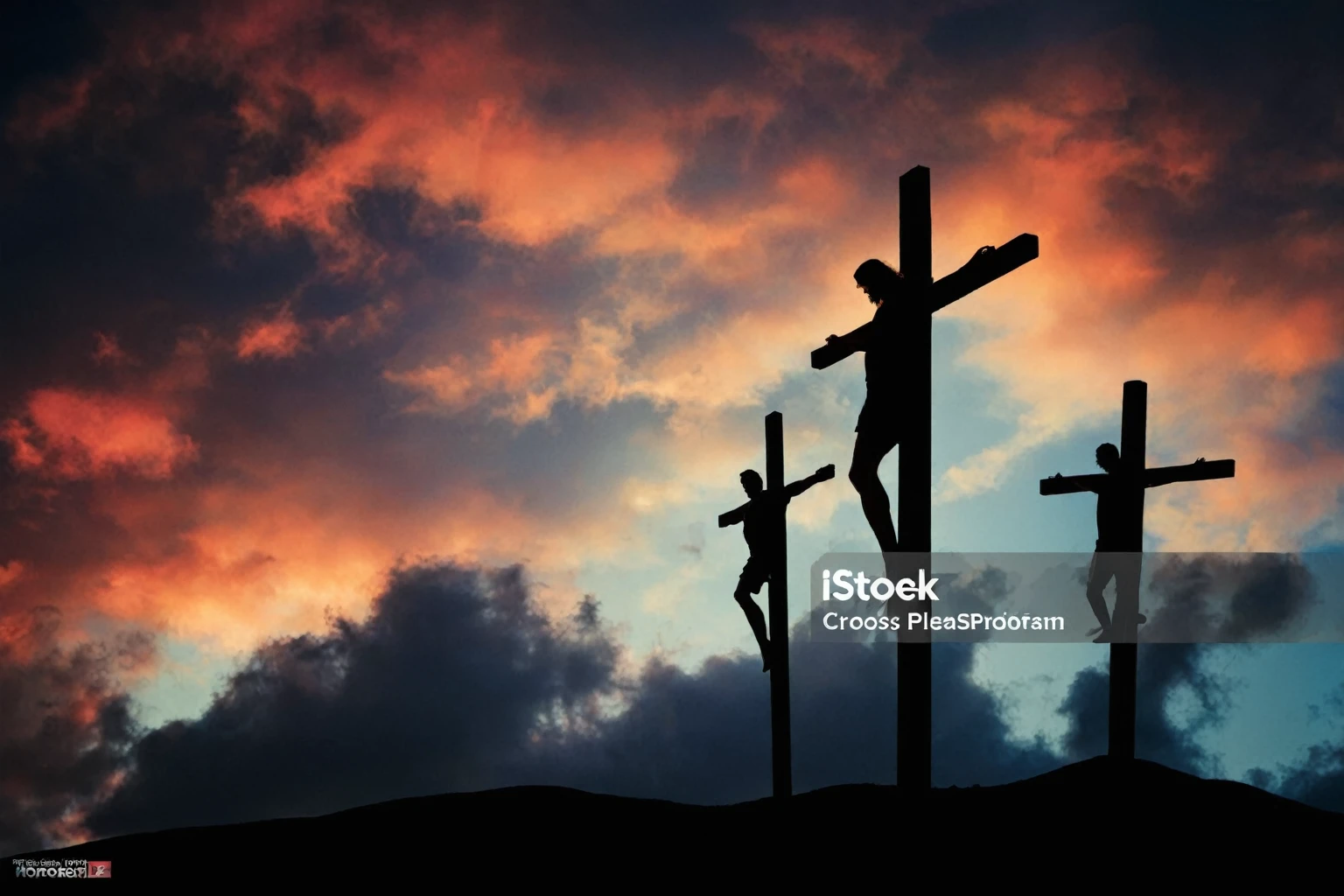 Jesus Christ on the cross along with 2 other men