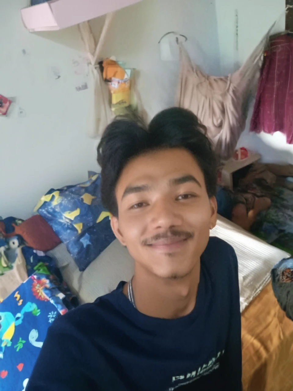 18 years old man sitting on the bed, 8k, full body shot, hyperrealistic, documentary photography, glow in the dark, ☹️, bedroom, nightwear