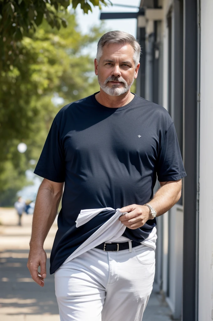 White-skinned man, approximately 55 years old., short black hair, semi fat with white t-shirt and dark blue pants