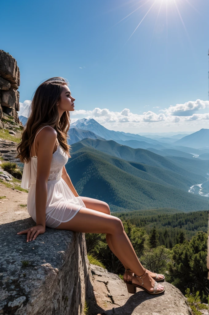 Beautiful woman on top of the mountain, looking at the landscape with a feeling of longing