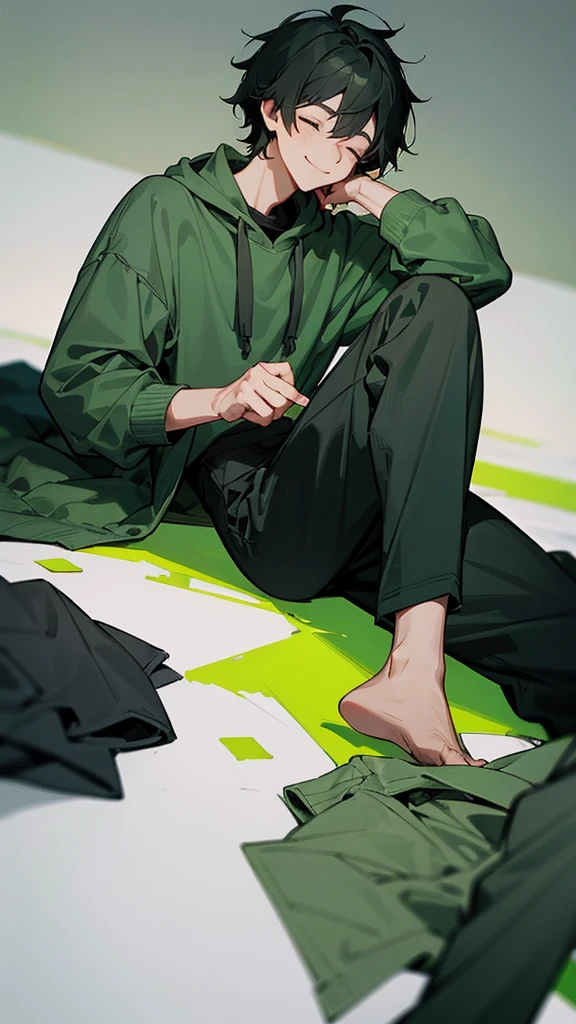 a young man wearing a green sweatshirt, black and gray pants, messy black hair, with closed eyes and smiling.