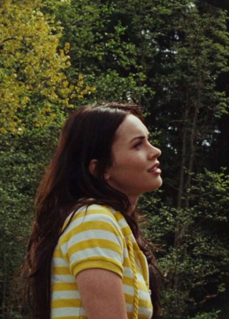 Sheltered woman standing in the rain in front of a motel sign, aura megan fox e fios, unearthly golden eyes, promotion still, unearthly, Iconic scene, Dean Winchester, profile pic, most memorable scene, promotional still wide angle, looking at her side, television still, intense combustion, programa de tv ainda, environmental photo