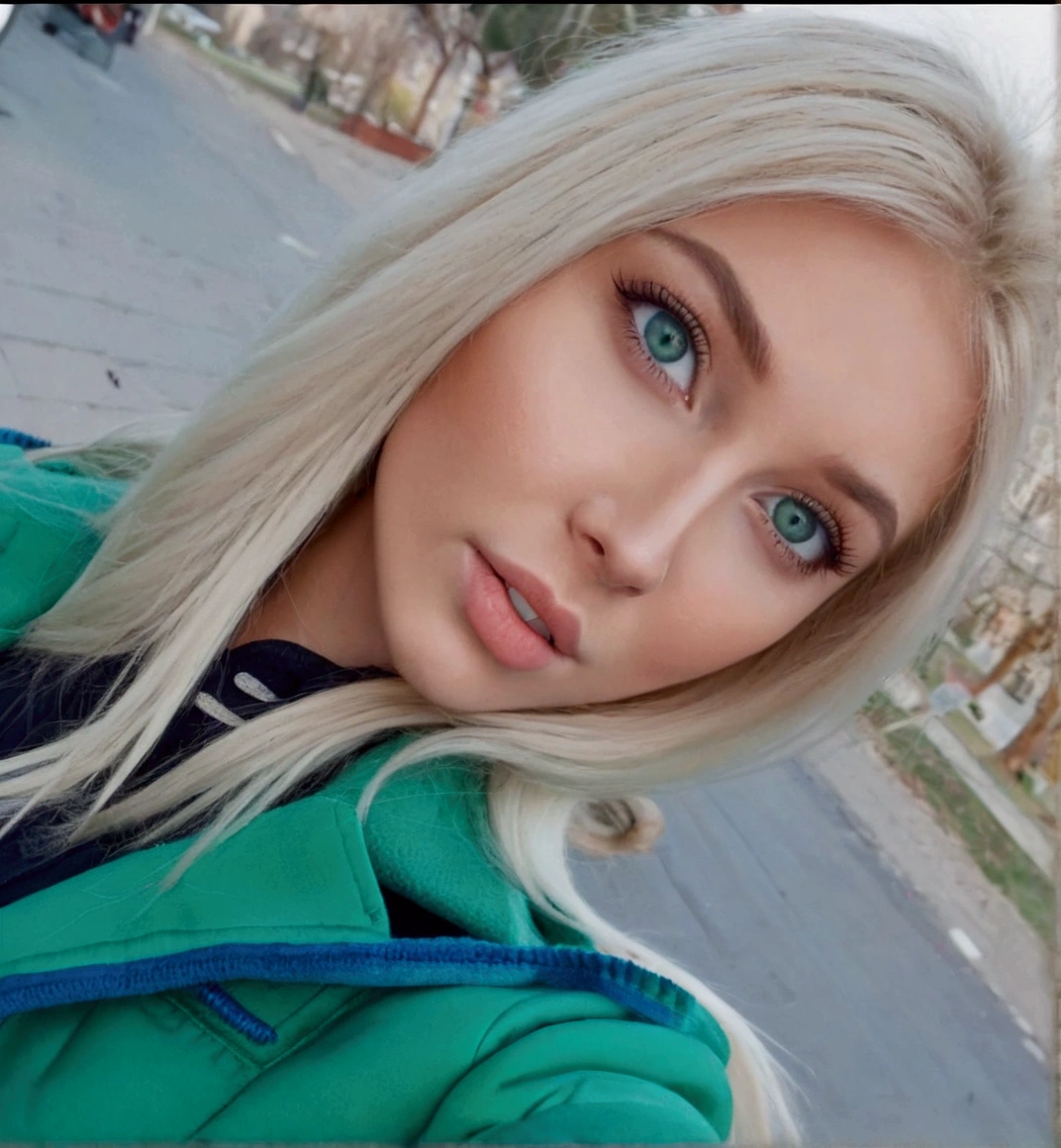 Blonde woman with blue eyes and green jacket taking a selfie, blonde hair and blue eyes, blonde hair blue eyes, blonde hair and big eyes, long blonde hair and big eyes, blue eyes and blonde hair, long blonde hair and blue eyes, blonde hair green eyes, blonde hair blue eyes, Perfect white hair girl, Irina Nordsol Kuzmina