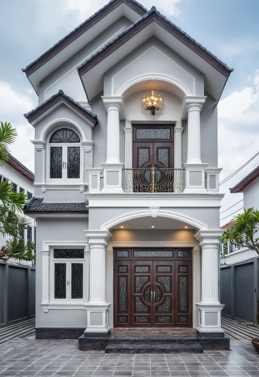 (bright image), A double story modern style house in the middle of Vietnam, (dark grnite tiled wall),(classic detail), simple and elegant architecture with white walls on top half and grey tiles roof, large windows with, entrance door is white with arched shape, bonsai trees, wide tile stone courtyard, professional photography, daylight, natural light, high resolution photography, (best quality, ultra realistic, masterpiece:1.15)