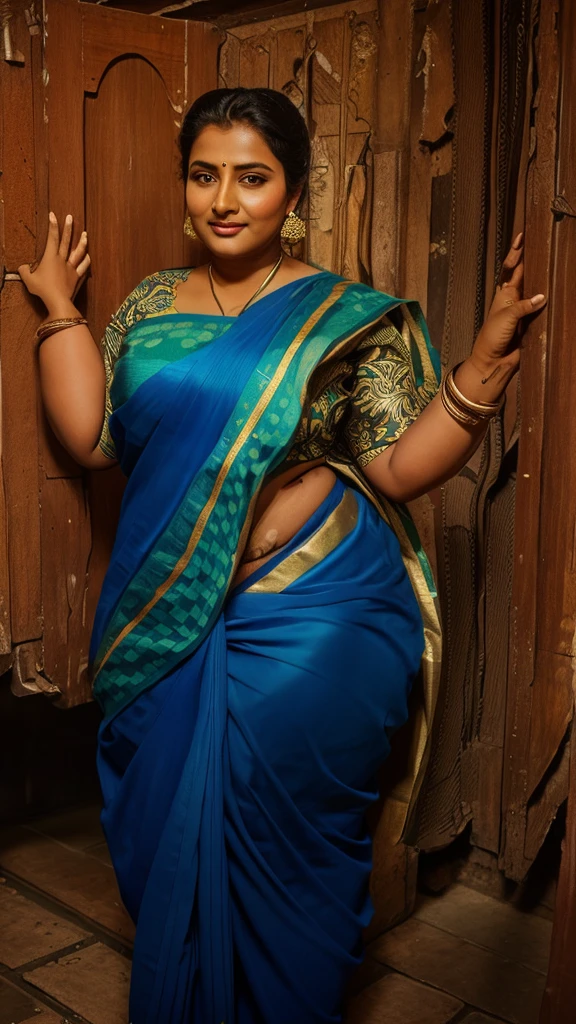 A indian.plus size bhabhi wearing blue saree and green blouse, she has big belly wide hips, fat legs