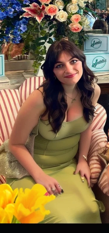 there is a woman sitting on a couch with flowers in the background, pretty female phoebe tonkin, lucy hale, phoebe tonkin, by Emma Andijewska, christina kritkou, kaitlyn michelle siragusa, joey king, green dress, profile photo, very very low quality picture, justina blakeney, Big tits, huge , no clothes, sexy, cute, wide hips, thick thighs, pear-shaped body, minimal clothes, thick, bbw, chubby stomach, thick nipples, nipple piercings, large areola, hard nipples, piercing through shirt, nipples hard through shirt, busty, major cleavage, naked, ripping through top, spilling over sides, bra too tight, giant , dominatrix, dominatrix clothes, revealing clothes, ass so fat you can see it from the front, giant tits, huge ass, wide girl, naked