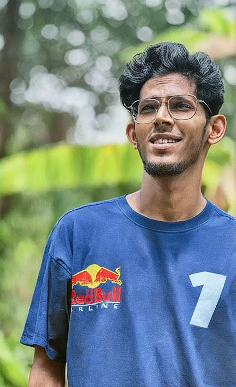 arafed man with glasses and a blue shirt is holding a banana, mohamed chahin, jayison devadas, mohamed chahin style, jayison devadas style, red bull, inspired by Nathan Oliveira, ismail, mutahar laughing, riyahd cassiem, mid shot portrait, post, front profile!!!!, ayan nag