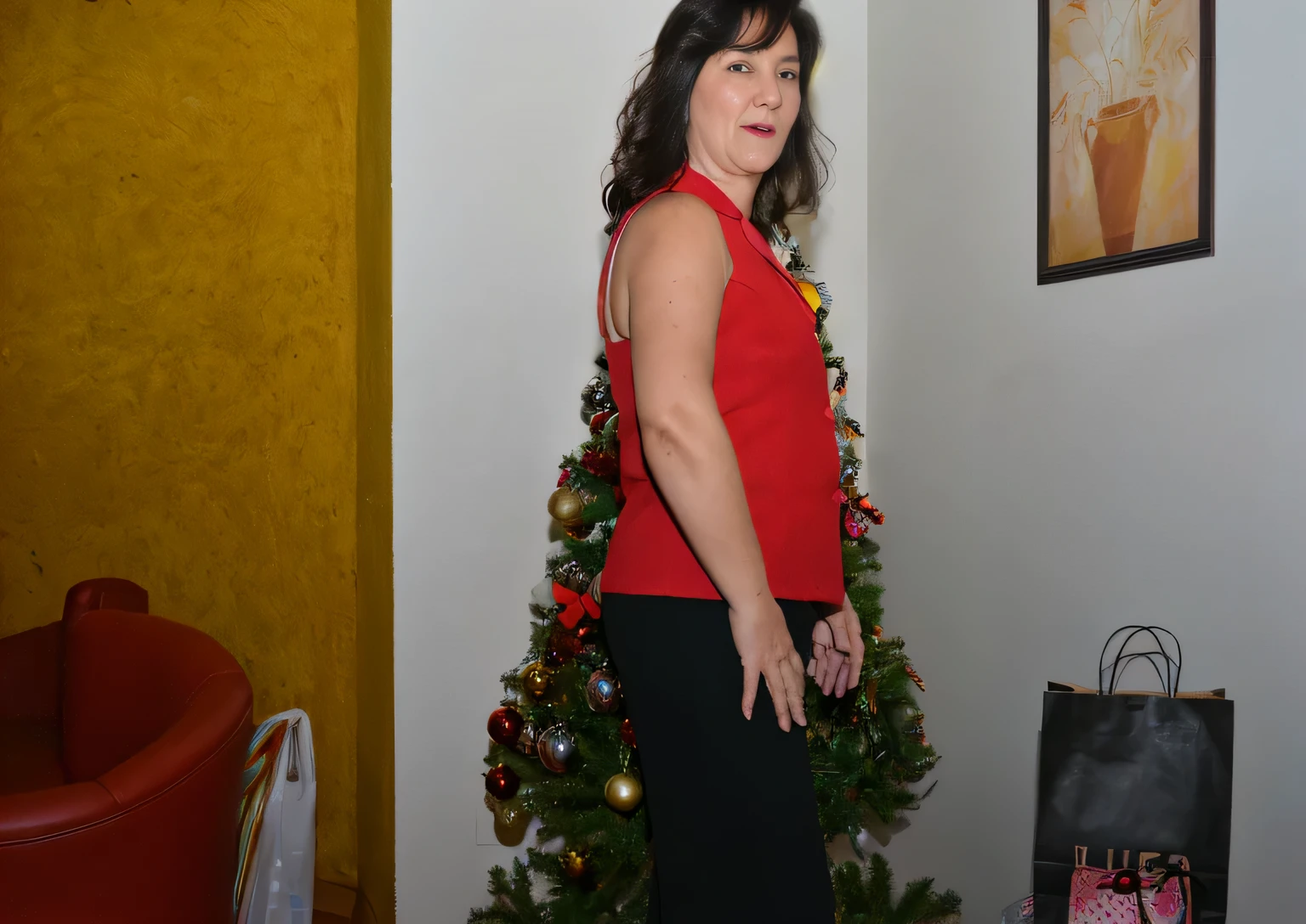 there is a woman standing in front of a christmas tree, with a tree in the background, photo from the back, photo from the side, 45 years woman, wearing festive clothing, photo taken from behind, photo from behind, with a red skirt, in red background, tree in the background, she is about 45 years old, wearing a red outfit