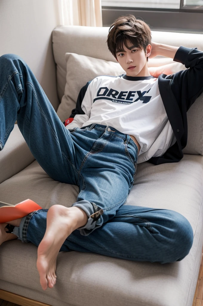 A guy is relaxing, wearing high school clothes,ripped pants,