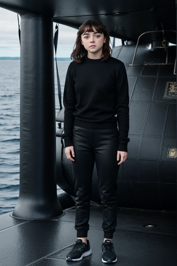 Beautiful brunette girl identical to Maisie Williams in a black sweater and long black pants and blue sports shoes standing on the bow of a submarine 